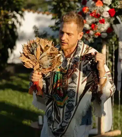Oliver, the founder of Harmonica, doing a prayer using his Waira