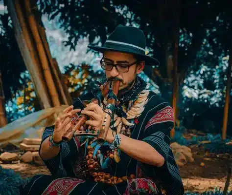 Sergio Henao the Yagecero at Harmonica Retreat pouring Ayahuasca into a cup