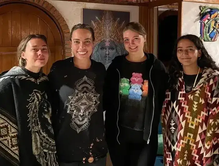 Harmonica Ayahuasca Retreat Colombia Friends at the retreat Four friends smiling together at the retreat