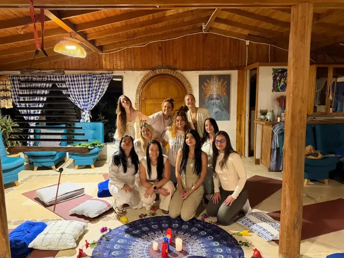 Harmonica Ayahuasca Retreat Colombia Group together indoors A group of women sitting together in the house