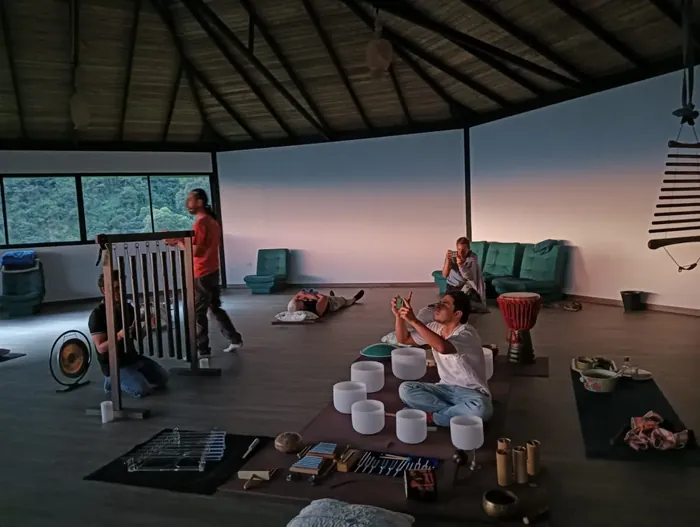 Harmonica Ayahuasca Retreat Colombia Maloka sound healing Sound healing in the maloka with crystal bowls, chimes and a drum