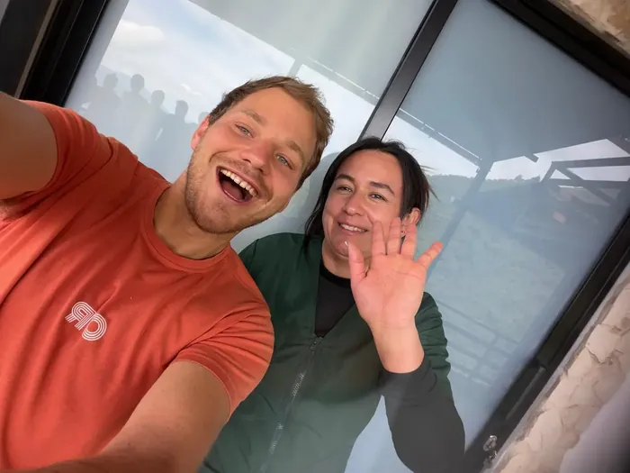 Harmonica Ayahuasca Retreat Colombia Oliver and Diana waving Oliver and Diana smiling and waving hello in a selfie