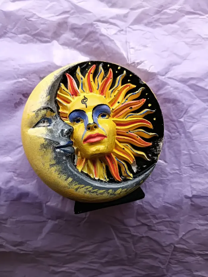 Harmonica Ayahuasca Retreat Colombia Sun and moon art A painted sun and moon artwork