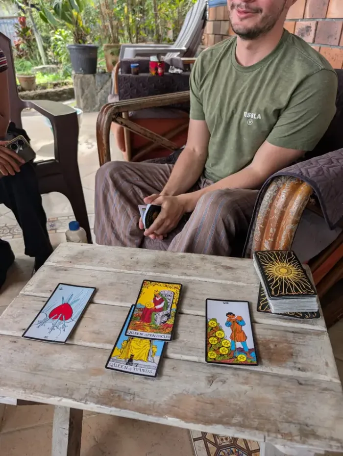 Harmonica Ayahuasca Retreat Colombia Tarot card reading Tarot cards laid out on a wooden table during a reading